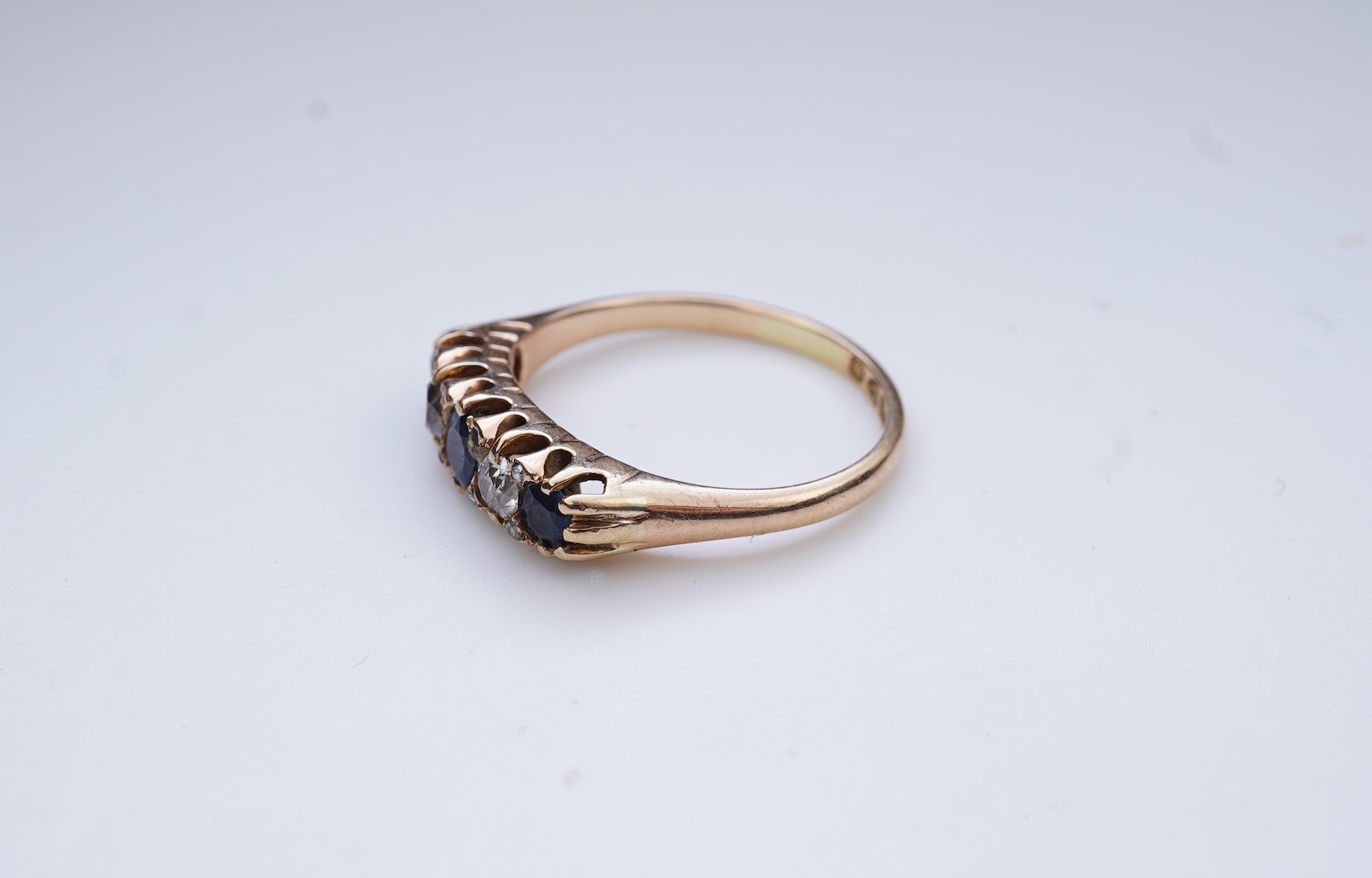 A sapphire and diamond five-stone ring, circa 1902